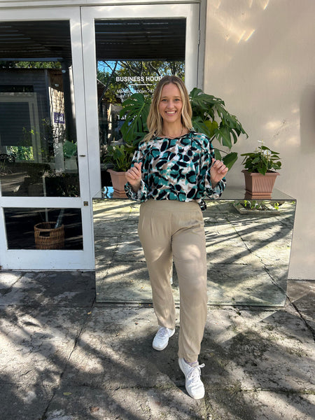 Turquoise Safari Frill Collar Blouse and Beige Linen Pleated Trousers