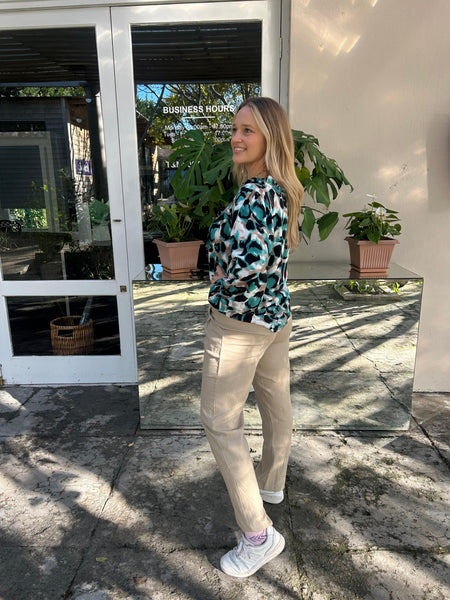 Turquoise Safari Frill Collar Blouse and Beige Linen Pleated Trousers
